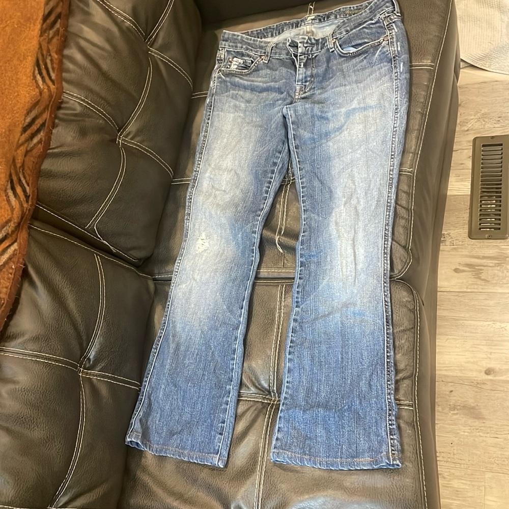 7 for all mankind distressed light washed flare low rise jeans